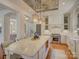 Spacious kitchen featuring a large island with bar seating, stainless steel appliances, and a decorative ceiling at 757 Shady Grove Xing, Fort Mill, SC 29708