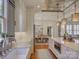 Beautiful kitchen with a decorative ceiling, marble countertops, and an open view of the dining and living areas at 757 Shady Grove Xing, Fort Mill, SC 29708