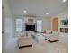 Bright living room with white sofas, built-in shelves, and natural light at 757 Shady Grove Xing, Fort Mill, SC 29708