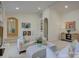 Open-concept living area featuring white sofas, built-in shelving, and stylish decor at 757 Shady Grove Xing, Fort Mill, SC 29708