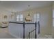 Bright loft space with chandelier lighting and staircase at 757 Shady Grove Xing, Fort Mill, SC 29708