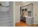 Office nook off stairway landing with built-in shelving and desk at 757 Shady Grove Xing, Fort Mill, SC 29708