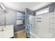 Neutral bathroom featuring a tub/shower combo with a shower curtain and a white sink with a modern faucet at 8259 Carob Tree Ln, Charlotte, NC 28215