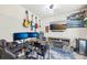 Well-lit bedroom featuring a large desk, tv, and cozy fireplace at 8259 Carob Tree Ln, Charlotte, NC 28215