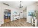 Spacious entryway with hardwood floors, leading to the kitchen and other living areas at 8259 Carob Tree Ln, Charlotte, NC 28215