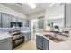 Modern kitchen with stainless steel appliances, sleek countertops, and stylish cabinetry at 8259 Carob Tree Ln, Charlotte, NC 28215