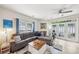 Comfortable living room with large sectional sofa, fireplace, and natural light from french doors at 8259 Carob Tree Ln, Charlotte, NC 28215