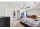 Comfortable bedroom with ceiling fan, window, matching nightstands and dressers at 8259 Carob Tree Ln, Charlotte, NC 28215