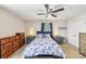Comfortable bedroom with ceiling fan, window, matching nightstands and dressers at 8259 Carob Tree Ln, Charlotte, NC 28215