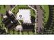 Aerial view of a community pool area with lounge chairs, umbrellas, and well-manicured grounds at 8441 Norman Forest Rd, Lancaster, SC 29720