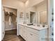 Bathroom featuring double sinks, a large mirror, and a walk-in closet at 8441 Norman Forest Rd, Lancaster, SC 29720
