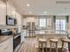 Modern kitchen equipped with stainless steel appliances, granite countertops, and a breakfast bar at 8441 Norman Forest Rd, Lancaster, SC 29720
