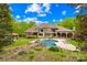 Stunning aerial view of a grand estate with a luxurious pool, manicured grounds, and a guest house at 8451 Ridgewood Rd, Sherrills Ford, NC 28673