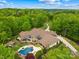 Aerial view of an expansive backyard featuring a pool, patio, and meticulously landscaped grounds perfect for entertaining at 8451 Ridgewood Rd, Sherrills Ford, NC 28673