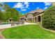 Beautiful backyard featuring an in-ground pool, lush lawn, and a covered patio at 8451 Ridgewood Rd, Sherrills Ford, NC 28673
