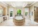 Luxurious bathroom with jacuzzi tub, decorative tile, and natural light at 8451 Ridgewood Rd, Sherrills Ford, NC 28673