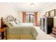 Bright bedroom featuring a wrought iron bed frame, balcony access, and ample natural light at 8451 Ridgewood Rd, Sherrills Ford, NC 28673