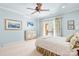 Well-lit bedroom with a large bed, soft carpet, and access to a private balcony at 8451 Ridgewood Rd, Sherrills Ford, NC 28673