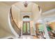 Elegant foyer with a curved staircase, hardwood floors, high ceilings, and decorative lighting at 8451 Ridgewood Rd, Sherrills Ford, NC 28673