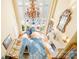 Overhead view of living room with vaulted ceilings, piano, and fireplace at 8451 Ridgewood Rd, Sherrills Ford, NC 28673