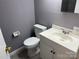 Bathroom featuring a white vanity, toilet, tiled floors and neutral gray walls for a clean look at 9325 Old Concord Rd # D, Charlotte, NC 28213