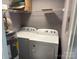 Functional laundry area with washer, dryer, and shelving at 9325 Old Concord Rd # D, Charlotte, NC 28213