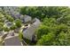An aerial view captures the home's backyard and surrounding wooded area at 9437 Tavistock Ct, Matthews, NC 28105