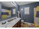Bathroom features a double sink vanity, tile floor, and shower curtain at 9437 Tavistock Ct, Matthews, NC 28105