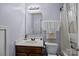 Classic bathroom with a vanity, a mirror, and a shower-tub combo, providing essential features at 9437 Tavistock Ct, Matthews, NC 28105