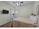 Bedroom with tv, neutral paint, and plenty of natural light at 9437 Tavistock Ct, Matthews, NC 28105