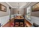 Elegant dining room with modern chandelier, decorative rug, and ample natural light at 9437 Tavistock Ct, Matthews, NC 28105