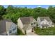 Two-story home featuring a two-car garage, a landscaped front yard, and charming curb appeal at 9437 Tavistock Ct, Matthews, NC 28105