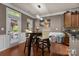 Eat-in kitchen features modern light fixture and access to outside patio at 9437 Tavistock Ct, Matthews, NC 28105
