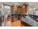 Gourmet kitchen with stainless steel appliances, granite countertops, and hardwood floors at 9437 Tavistock Ct, Matthews, NC 28105