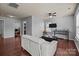 Open-concept living room with hardwood floors, ceiling fan, and natural light at 9437 Tavistock Ct, Matthews, NC 28105