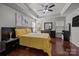 Large bedroom features dark wood floors, ample natural light, and neutral gray walls at 9437 Tavistock Ct, Matthews, NC 28105