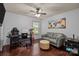 Office space with dark hardwood floors, gaming chair, and comfortable seating at 9437 Tavistock Ct, Matthews, NC 28105