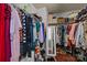 Walk-in closet with custom organization for clothes, shoes, and accessories at 9437 Tavistock Ct, Matthews, NC 28105
