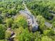 Birds eye view of the property surrounded by mature trees at 1000 E Woodlawn Rd # 408, Charlotte, NC 28209