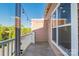 Outdoor balcony with string lights, offering a cozy and private outdoor space at 1000 E Woodlawn Rd # 408, Charlotte, NC 28209