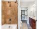 Bathroom featuring a tub, shower with tile surround, and closet for plenty of storage at 1000 E Woodlawn Rd # 408, Charlotte, NC 28209