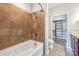 Bathroom featuring a tub, shower with tile surround, and closet for plenty of storage at 1000 E Woodlawn Rd # 408, Charlotte, NC 28209