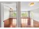 Bright bedrooms featuring hardwood floors and large windows with views of nature at 1000 E Woodlawn Rd # 408, Charlotte, NC 28209