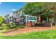 Apartment building with a 'Preston at Flats' sign, showcasing the well-kept exterior at 1000 E Woodlawn Rd # 408, Charlotte, NC 28209