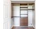 Organized closet system featuring shelves, drawers, and hanging rods for efficient storage at 1000 E Woodlawn Rd # 408, Charlotte, NC 28209