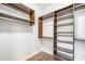 Custom closet layout with shelves and bars maximizes space and adds storage to the home at 1000 E Woodlawn Rd # 408, Charlotte, NC 28209