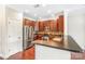 Charming kitchen featuring stainless appliances, stylish backsplash, and a convenient breakfast bar at 1000 E Woodlawn Rd # 408, Charlotte, NC 28209