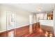Spacious living room with hardwood floors, neutral walls, and ample natural light, flowing into the kitchen at 1000 E Woodlawn Rd # 408, Charlotte, NC 28209