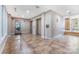 Clean lobby with tile floors, seating, and access to elevators at 1000 E Woodlawn Rd # 408, Charlotte, NC 28209