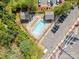 Aerial view of pool and recreation area with lounge chairs at 1000 E Woodlawn Rd # 408, Charlotte, NC 28209